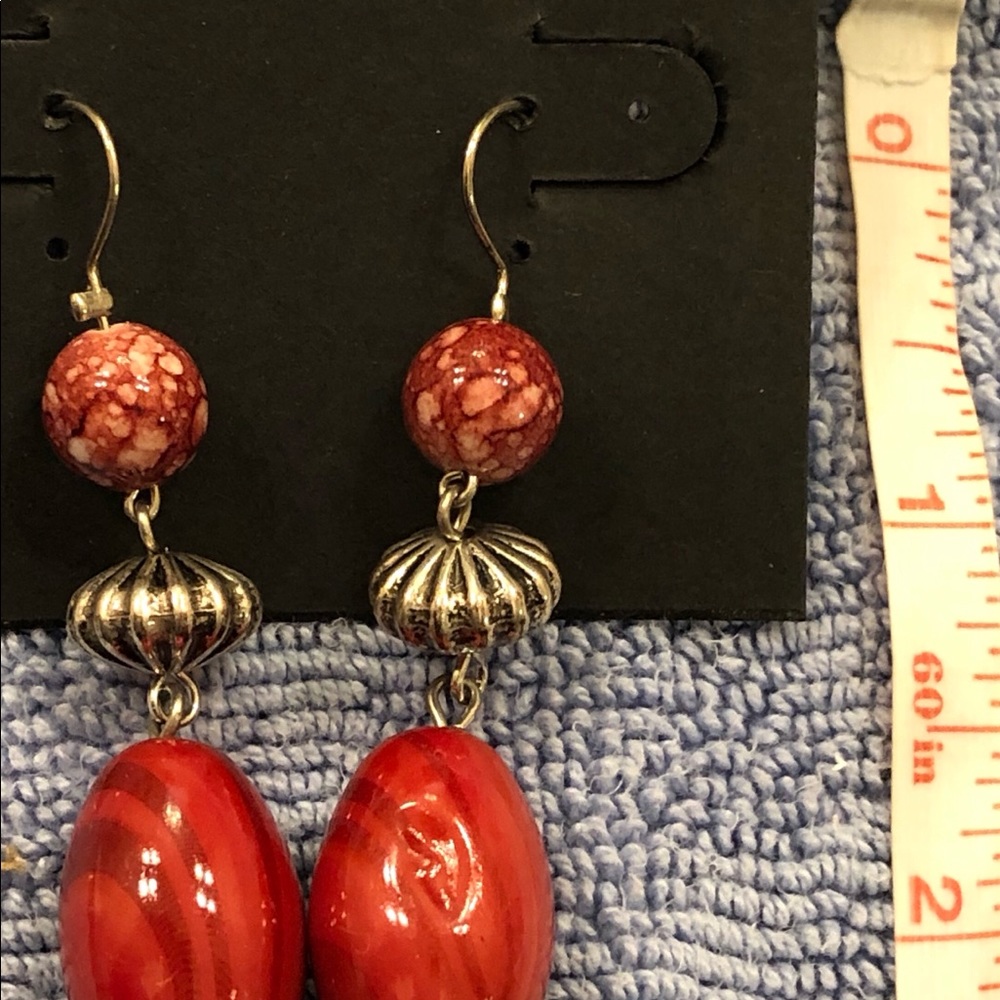 Pair of red earrings for pierced ears.